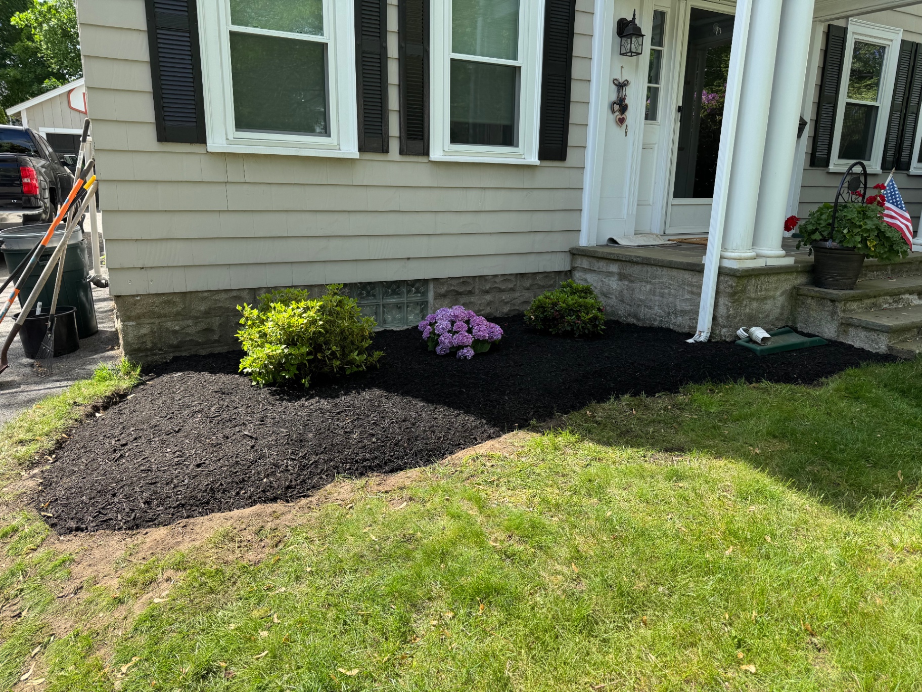 Front entry foundation bed with hydrangeas and fresh black mulch